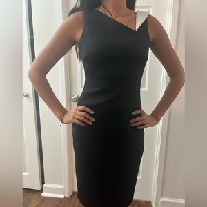 Black & white dress with gold zipper, formal or professional wear, no flaws